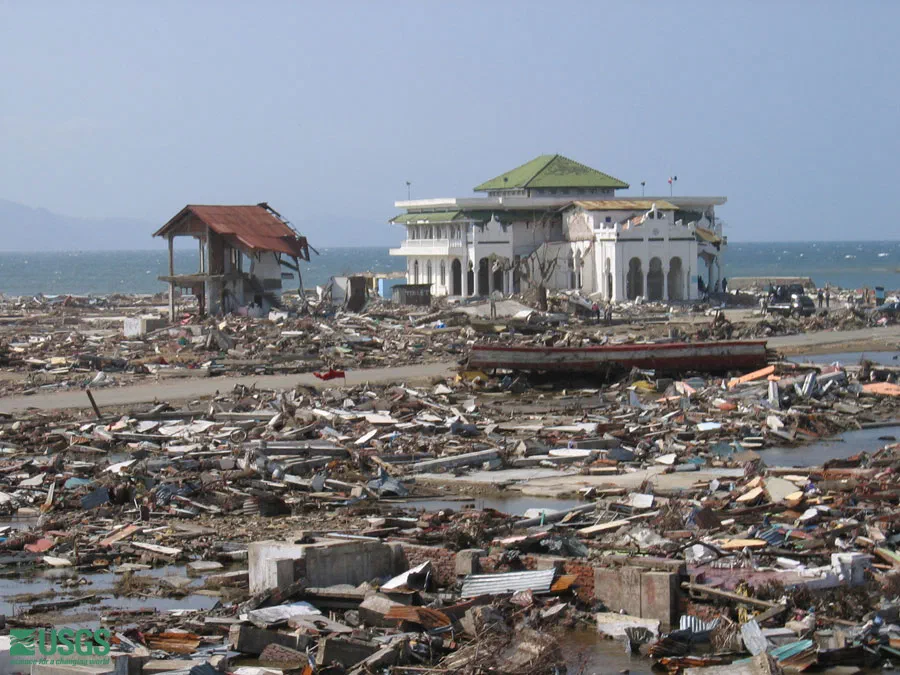 A mosque is left standing amid the rubble in Banda Aceh, post 2004 tsunami. Several mosques survived and may have been saved by the open ground floor that is part of their design. The tsunami waves reached the middle of the second floor.