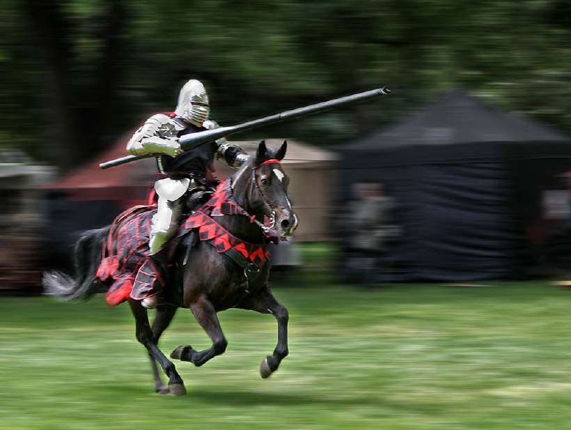 Armored rider with lance on horse