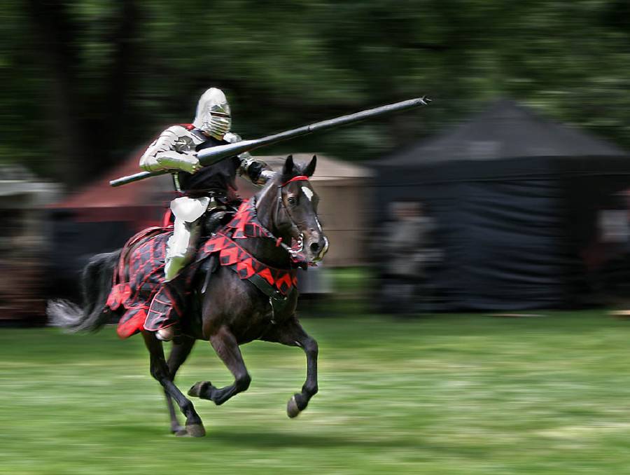 Armored rider with lance on horse