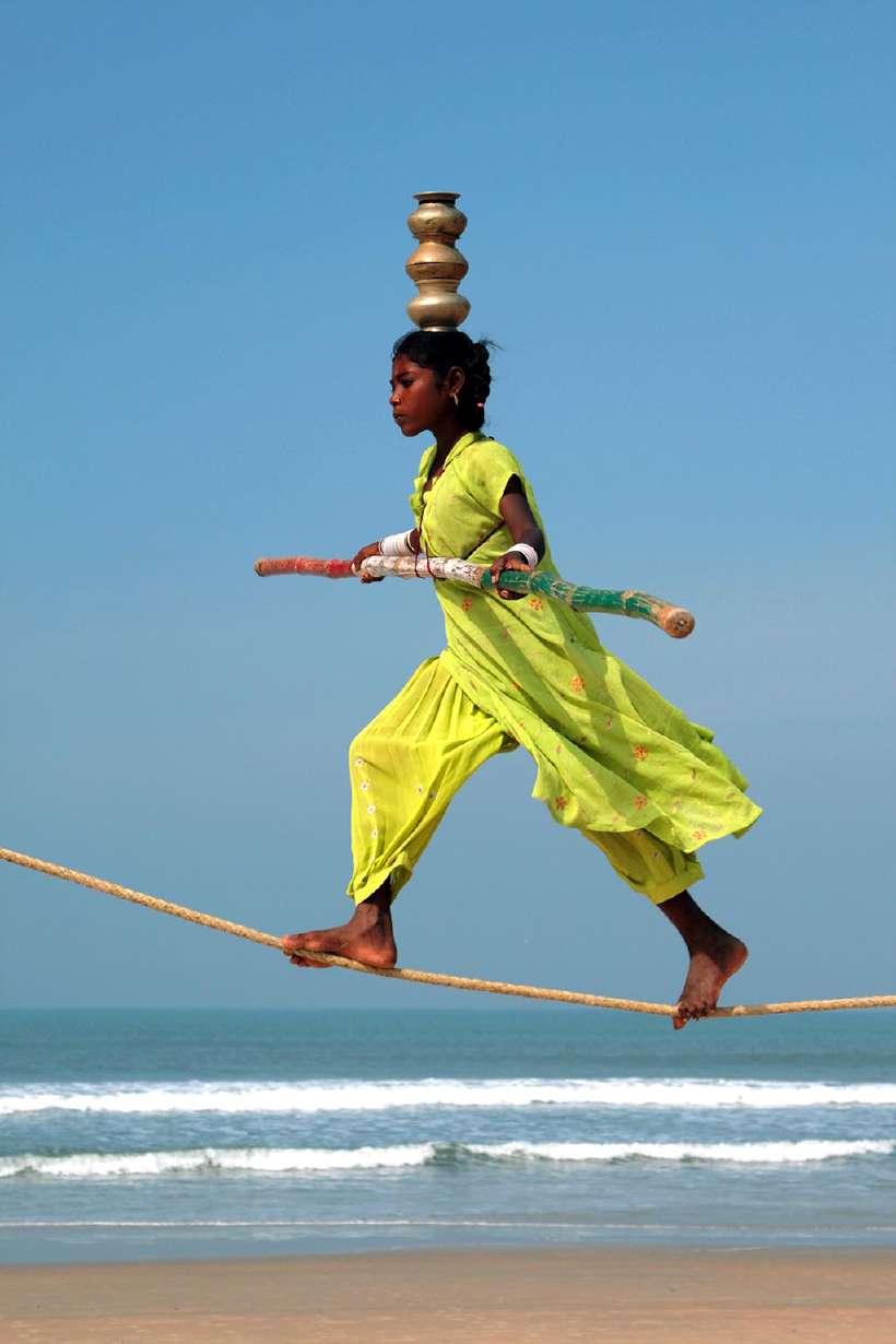 Wandering indian tightrope walker on a beach in Goa. [Katoosha](http://www.shutterstock.com/gallery-1378924p1.html?cr=00&pl=edit-00) / [Shutterstock.com](http://www.shutterstock.com/?cr=00&pl=edit-00)
