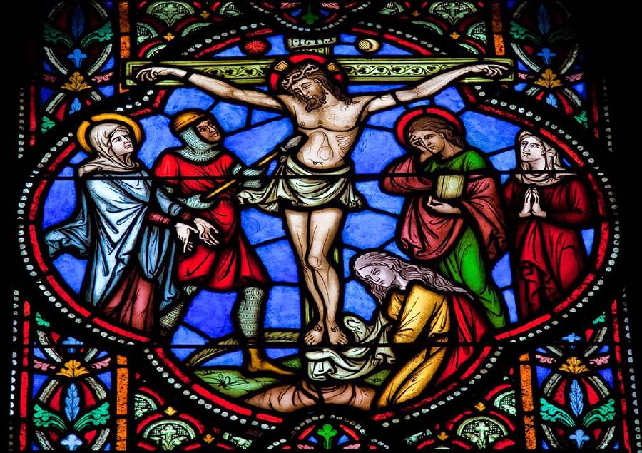 Stained glass window depicting Jesus on the cross in the cathedral of Brussels. [jorisvo](http://www.shutterstock.com/gallery-106159p1.html?cr=00&pl=edit-00) / [Shutterstock.com](http://www.shutterstock.com/?cr=00&pl=edit-00)