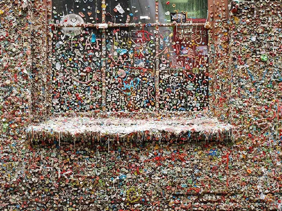 The Market Theater Gum Wall is a local landmark in downtown Seattle. This brick alleyway wall is covered in used chewing gum which is several inches thick at places.