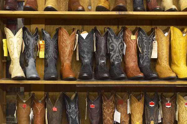 Shelf full of cowboy boots