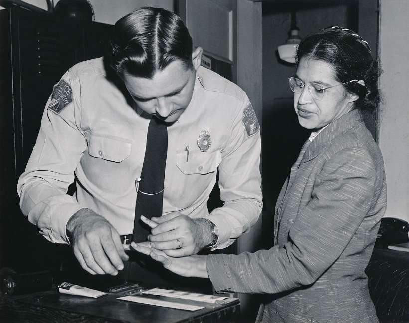 Parks being fingerprinted by Lieutenant D.H. Lackey on February 22, 1956