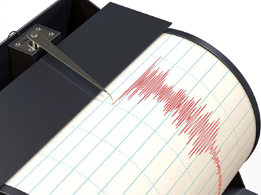 Seismograph instrument recording ground motion during earthquake
