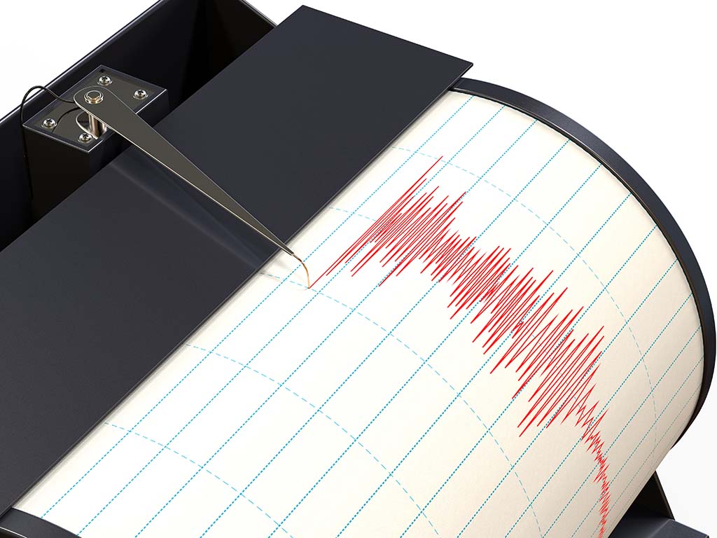 Seismograph instrument recording ground motion during earthquake